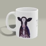 Outstanding Baby Calf Mug: The perfect Gift for Ranchers! - Angels Fly Here - AFH - Mug is displayed on a white background to show of the outstanding artwork and colors of the mug. The artwork is in full display and the bible verse is clearly visible on this excellent piece of functional art.