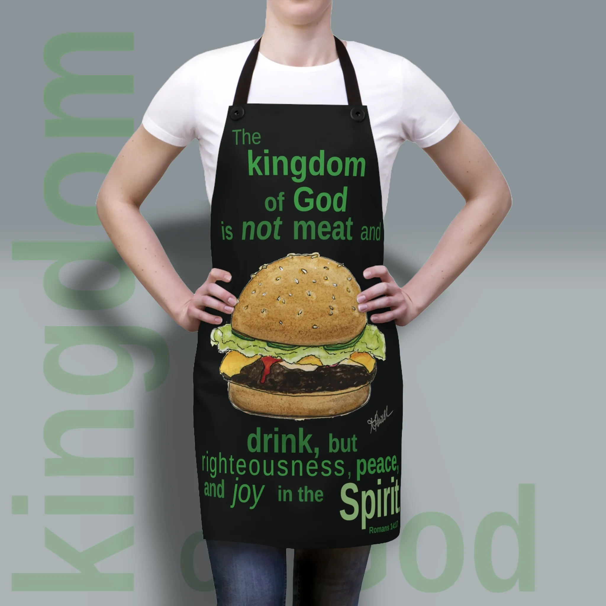 New Kingdom of God Apron: Joy in the Spirit being show worn by a woman to show the fit and finish of this exceptional quality and stylish product. Perfect for your next grill out or daily use around the kitchen.