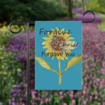 Forgive as Christ: Beautiful, Vibrant, Sunflower Flag shown on a flag holder in a flower garden