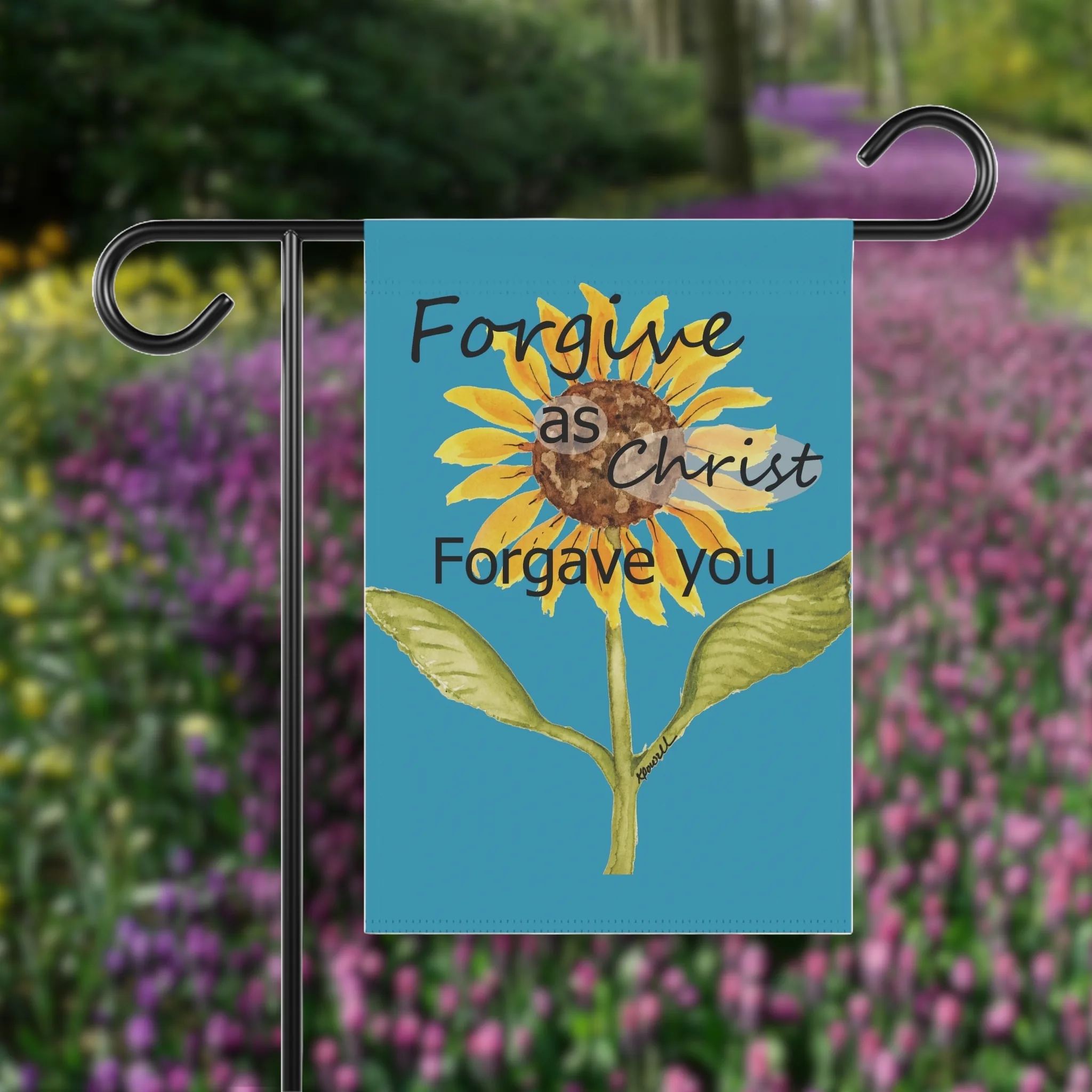 Forgive as Christ: Beautiful, Vibrant, Sunflower Flag shown on a flag holder in a flower garden