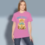 Bear Hug Tee The Grateful Embrace of God's Love Azalea Colored Haloed Tee Happy Female Customer Wearing the Tee Shirt