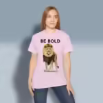 Bold Beautiful Lion Tee Daring, Fearless, Inspiration from Proverbs Light Pink Colored Haloed T-Shirt Happy Female Customer Wearing The Tee Shirt