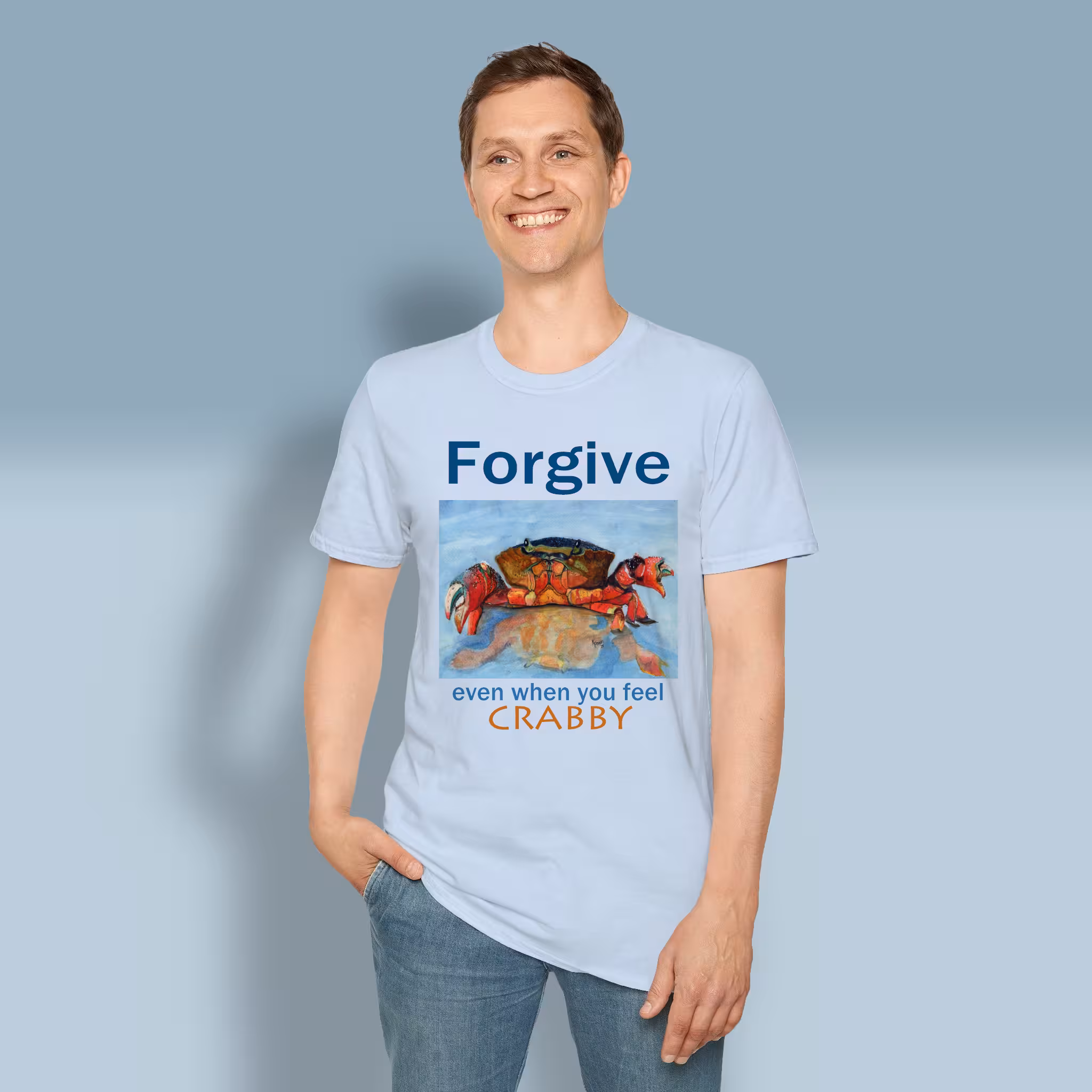 Crabby Forgiveness Tee Beautiful Ocean Shoreline Epic Art Light Blue Colored Haloed Tee Happy male customer wearing the Tee Shirt
