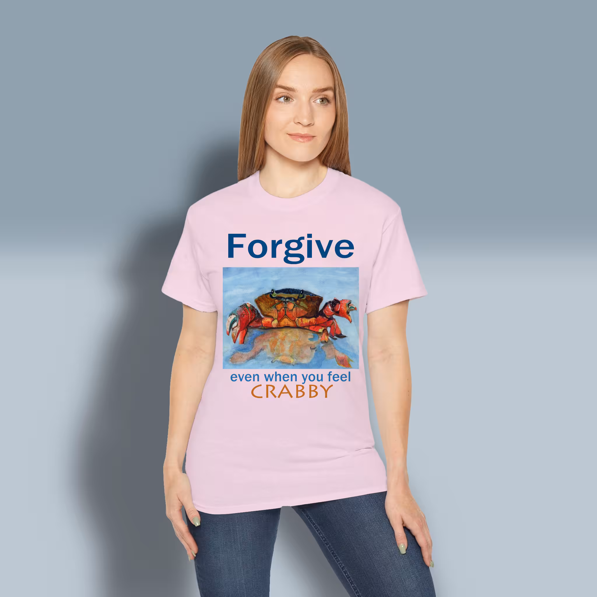 Crabby Forgiveness Tee Beautiful Ocean Shoreline Epic Art Light Pink Colored Haloed Tee Happy Female customer wearing the tee shirt
