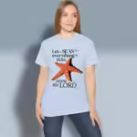 Starfish Praise Tee New Stunning Oceanic Design Light Blue Colored Haloed Tee happy female customer wearing the tee shirt